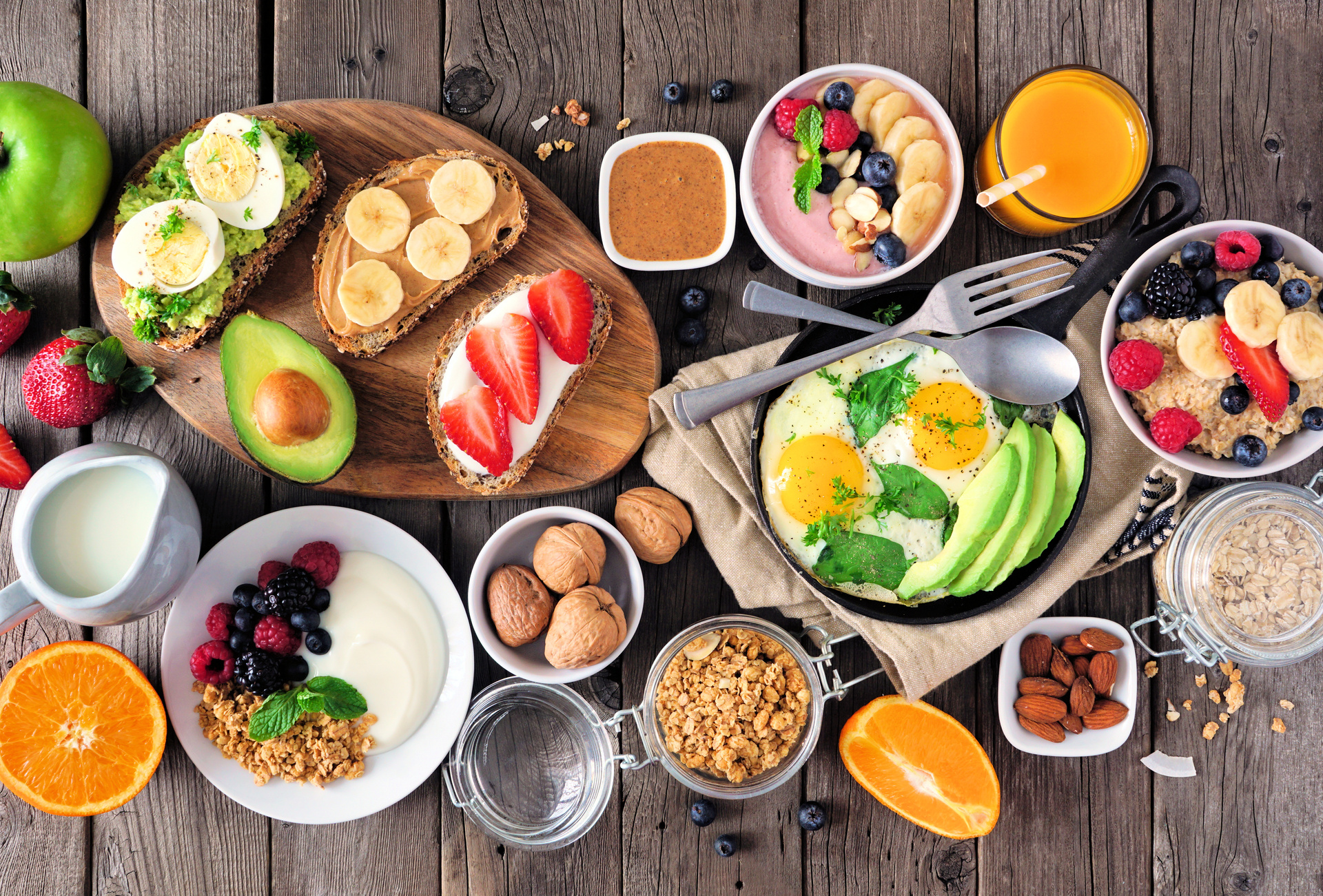 Office breakfast spread with toast, eggs, fruit, yogurt, and juice.